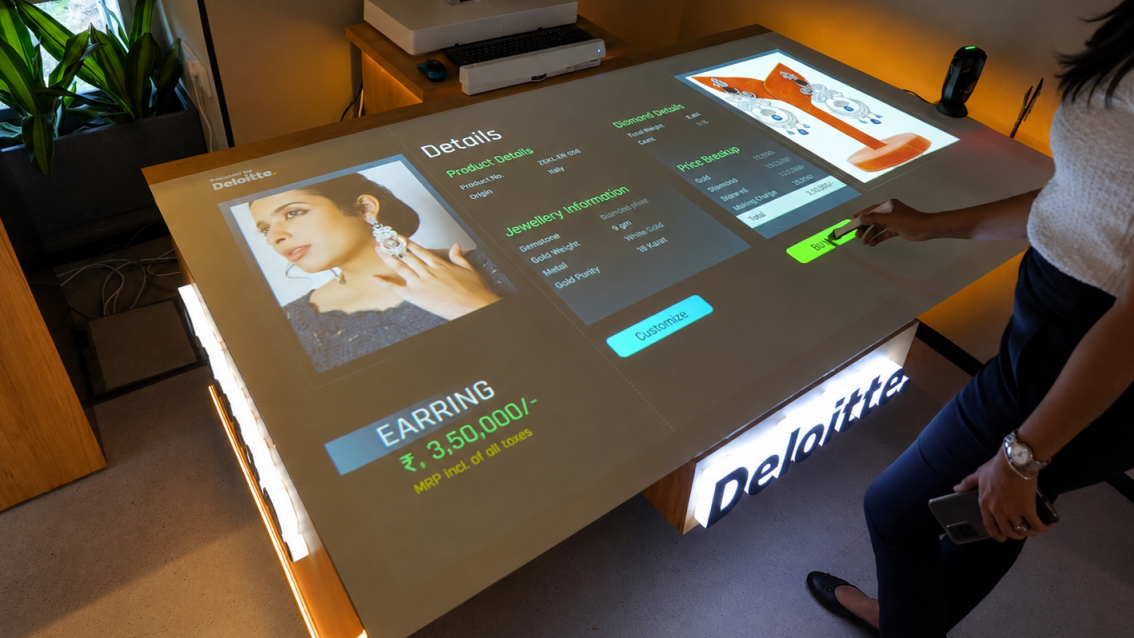 Interactive product recognition table displaying jewellery details in Deloitte retail experience center